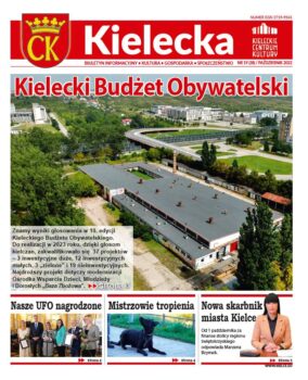 Grafika. Pierwsza strona 19 numeru biuletynu Kielecka. Glowny tekst: Kielecki Budżet Obywatelski. Poniżej zdjęcie dużego budynku z płaskim szarym dachem. Trzy mniejsze teksty: Nasze UFO nagrodzone. Mistrzowie tropienia i Nowa skarbnik miasta Kielce.